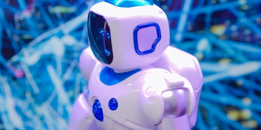 Cute white AI robot representing artificial intelligence technology and machine learning courses
