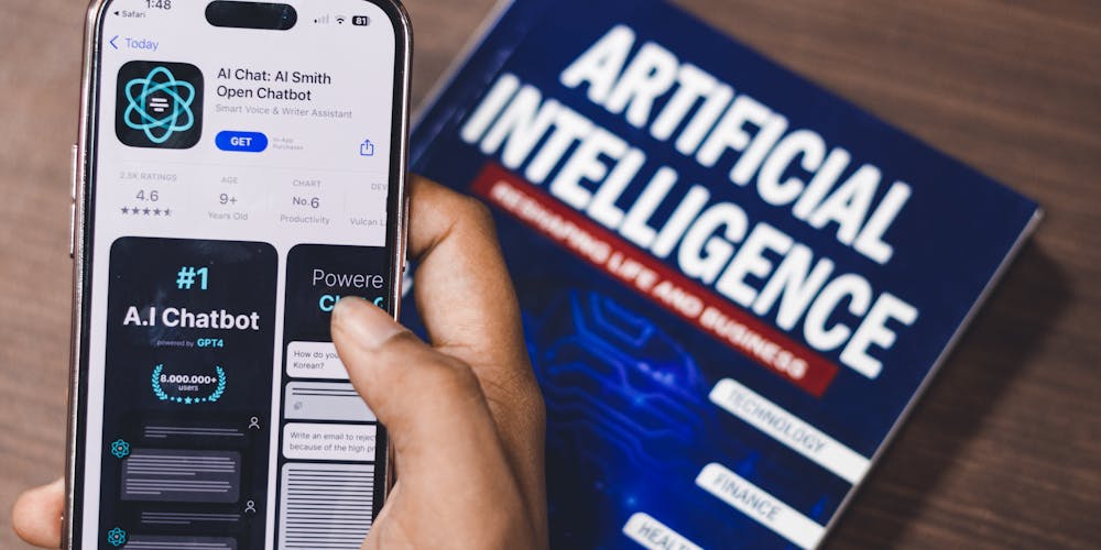 Person holding artificial intelligence book or tablet representing AI courses and learning