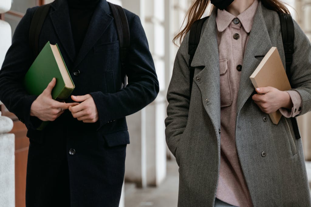 student visa overseas education Pakistan students carrying books on campus